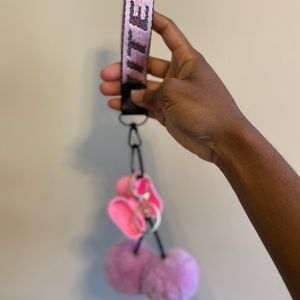 short off-white keychain w/ airpod case & puffball